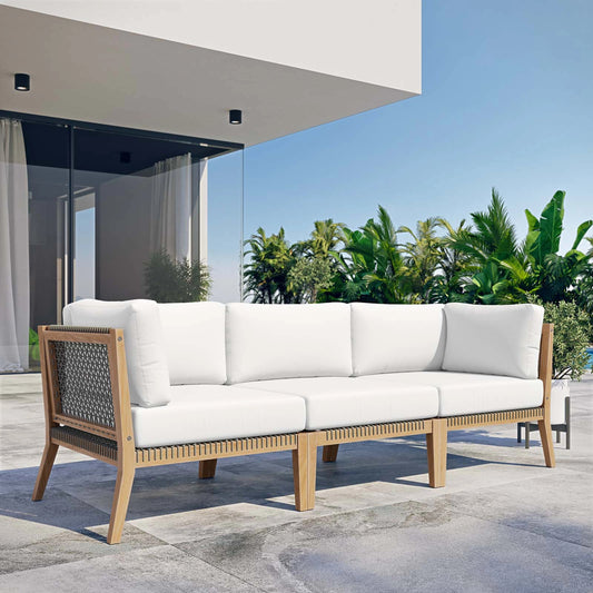 Cooper Teak Wood Sofa by Evans & Londeen. Made from teak wood, rope, quick dry foam, tack glides in a modern style.