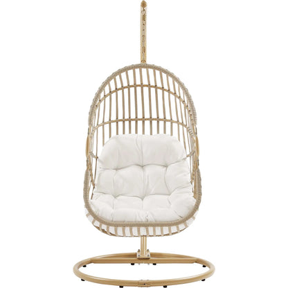Gilmer Rattan Swing Chair by Evans & Londeen in natural white. Made from steel, rattan, rope, weimas white fabric, natural rattan #7x-302, stand, base in natural color mc03, spring holder, 2m chains (extra), 280mm chains in a cottage &