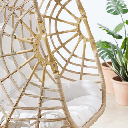 Gilmer Rattan Swing Chair by Evans & Londeen in natural white. Made from steel, rattan, rope, weimas white fabric, natural rattan #7x-302, stand, base in natural color mc03, spring holder, 2m chains (extra), 280mm chains in a cottage &
