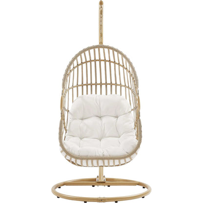 Gilmer Rattan Swing Chair by Evans & Londeen in natural white. Made from steel, rattan, rope, weimas white fabric, natural rattan #7x-302, stand, base in natural color mc03, spring holder, 2m chains (extra), 280mm chains in a cottage &