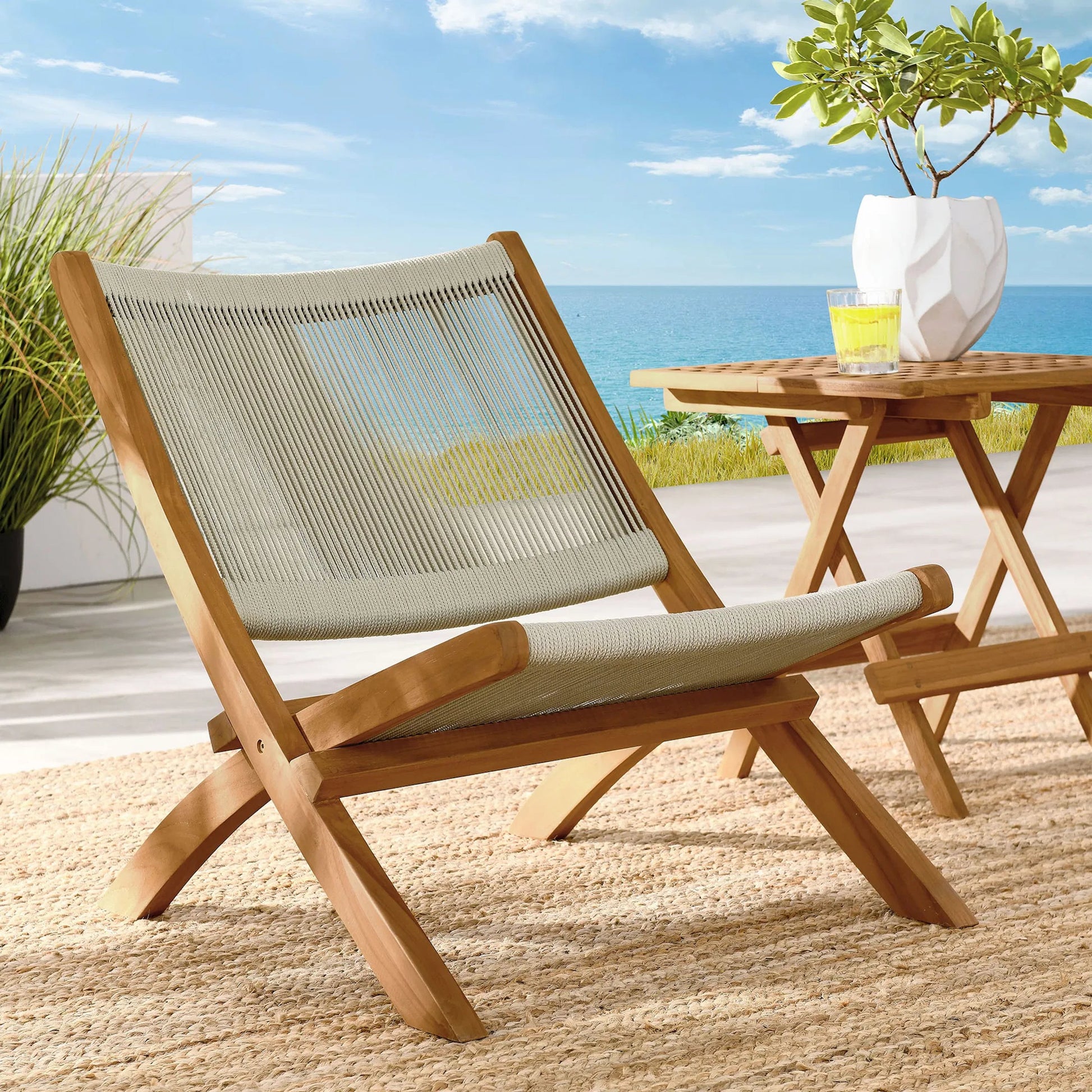 Irion Teak and Rope Folding Accent Lounge Chair by Evans & Londeen. Made from teak, rope in a modern style.