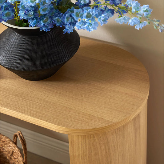 Rincon Oval Wood Console Table by Evans & Londeen in oak. Made from oval wood in a unique style.