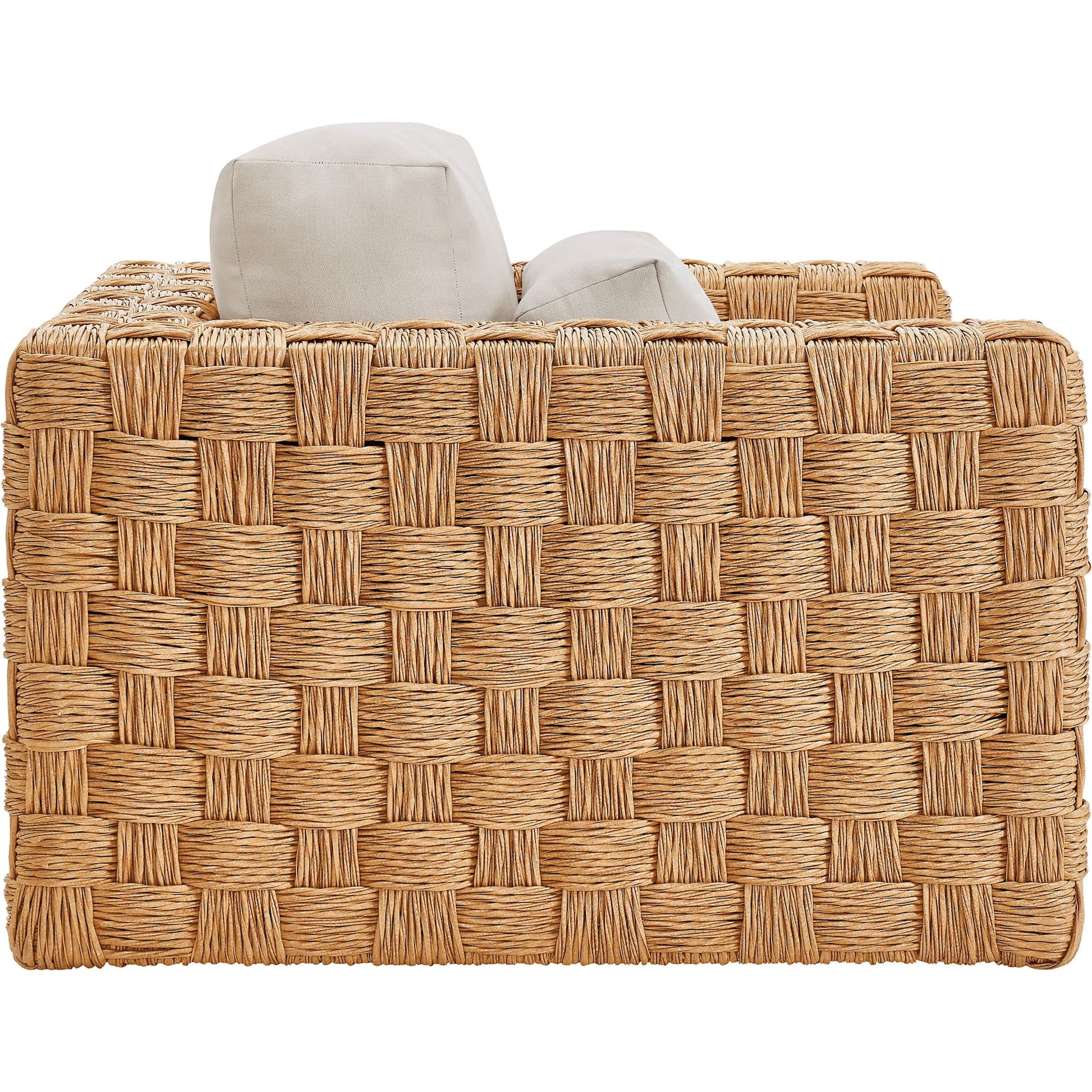 Volusia Rattan Armchair by Evans & Londeen in natural light gray. Made from rattan in a rustic style.