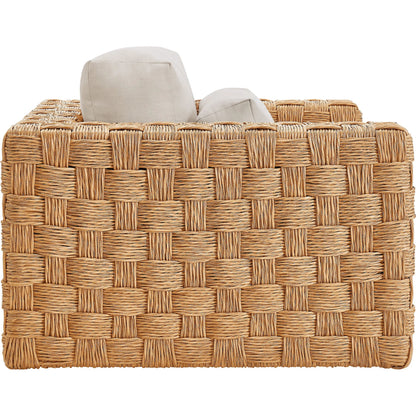 Volusia Rattan Armchair by Evans & Londeen in natural light gray. Made from rattan in a rustic style.