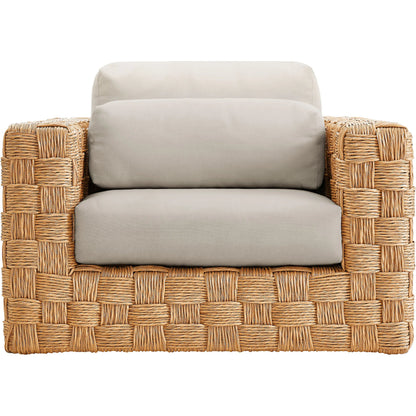Volusia Rattan Armchair by Evans & Londeen in natural light gray. Made from rattan in a rustic style.