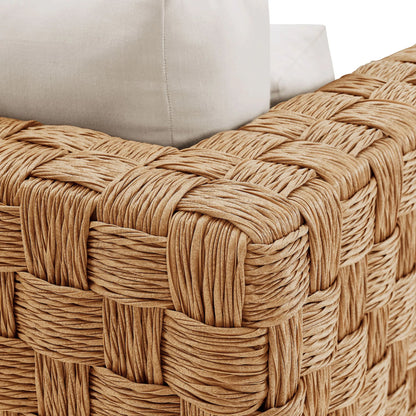 Volusia Rattan Armchair by Evans & Londeen in natural light gray. Made from rattan in a rustic style.