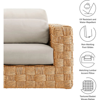 Volusia Rattan Armchair by Evans & Londeen in natural light gray. Made from rattan in a rustic style.