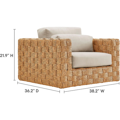 Volusia Rattan Armchair by Evans & Londeen in natural light gray. Made from rattan in a rustic style.