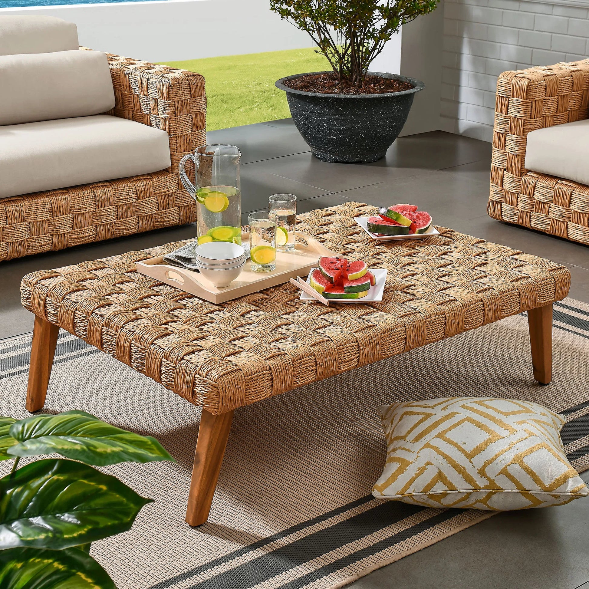 Volusia Rattan Coffee Table by Evans & Londeen in natural. Made from rattan in a rustic style.