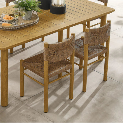 Spink Rattan and Aluminum Dining Side Chairs (Set of 2) by Evans & Londeen. Made from rattan, aluminum in a rustic style.