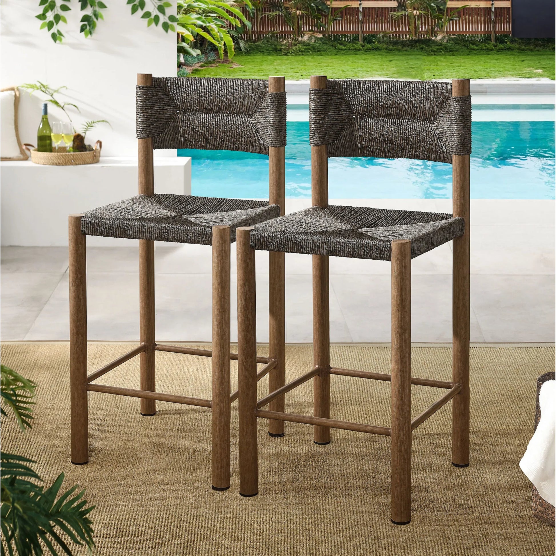 Spink Rattan and Aluminum Counter Stools (Set of 2) by Evans & Londeen. Made from rattan, aluminum in a rustic style.