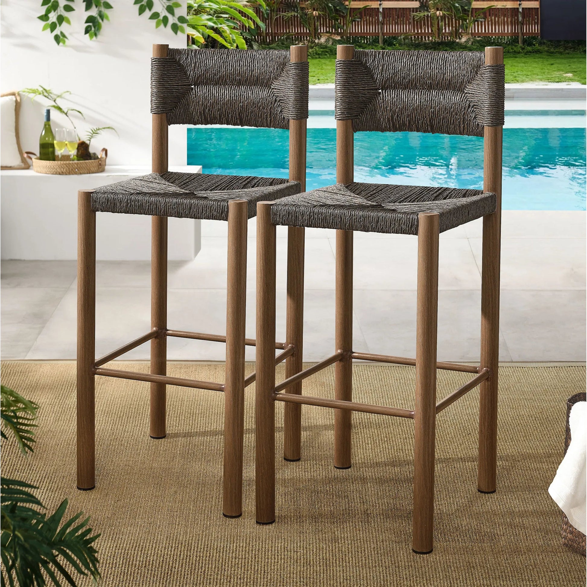 Spink Rattan and Aluminum Bar Stools (Set of 2) by Evans & Londeen. Made from rattan, aluminum in a rustic style.