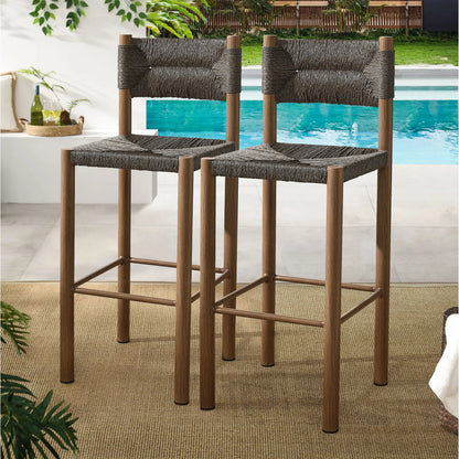 Spink Rattan and Aluminum Bar Stools (Set of 2) by Evans & Londeen. Made from rattan, aluminum in a rustic style.