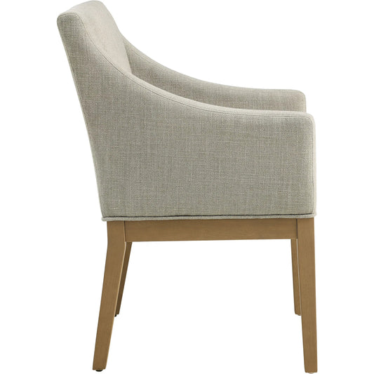 Williamson Dining Armchair by Evans & Londeen. Made from fabric upholstered in a unique style.