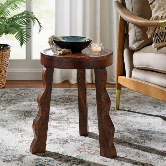 Tonganoxie Carved Wood Stool by Evans & Londeen in walnut. Made from carved wood in a unique style.