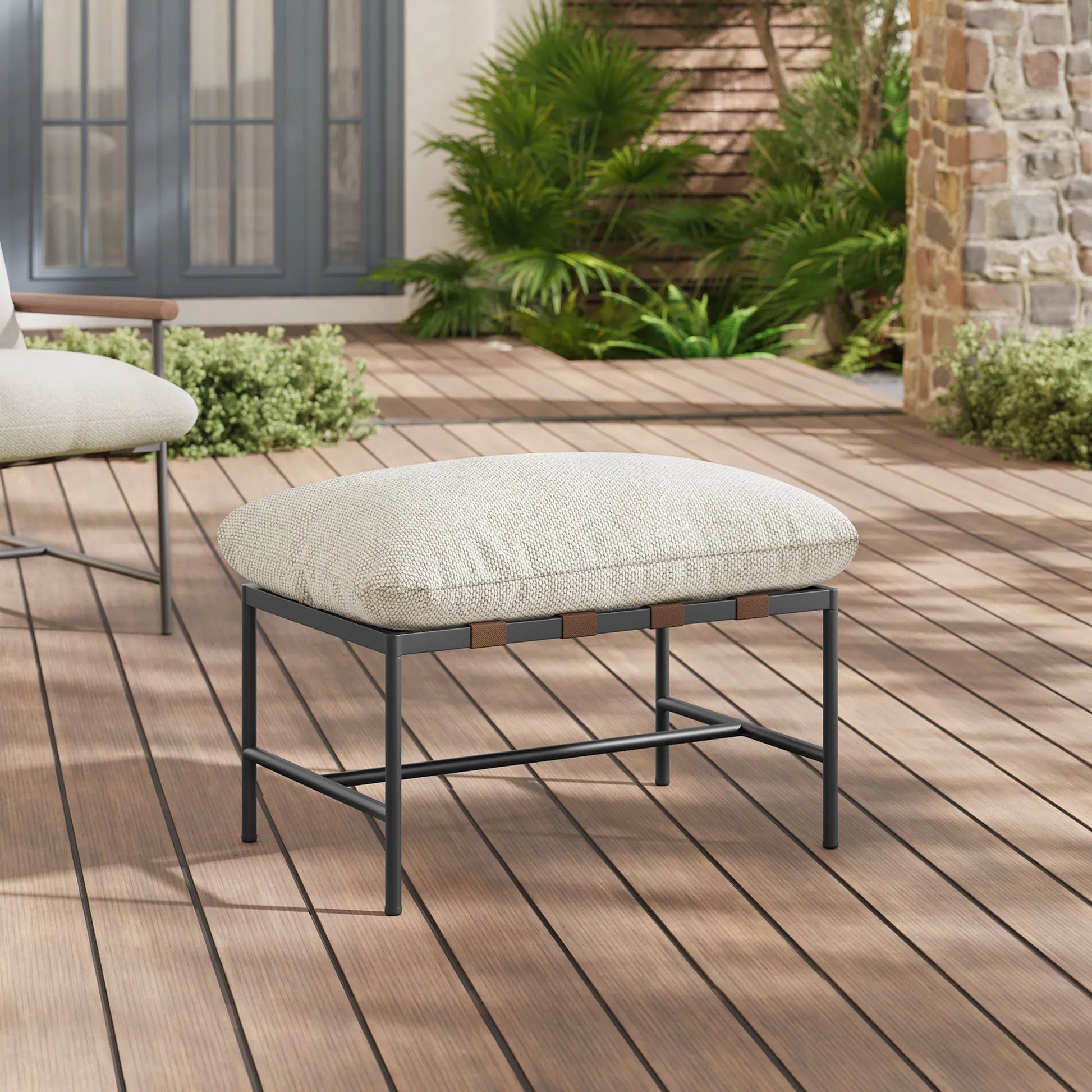 Iron Boucle Ottoman by Evans & Londeen. Made from boucle in a transitional style.