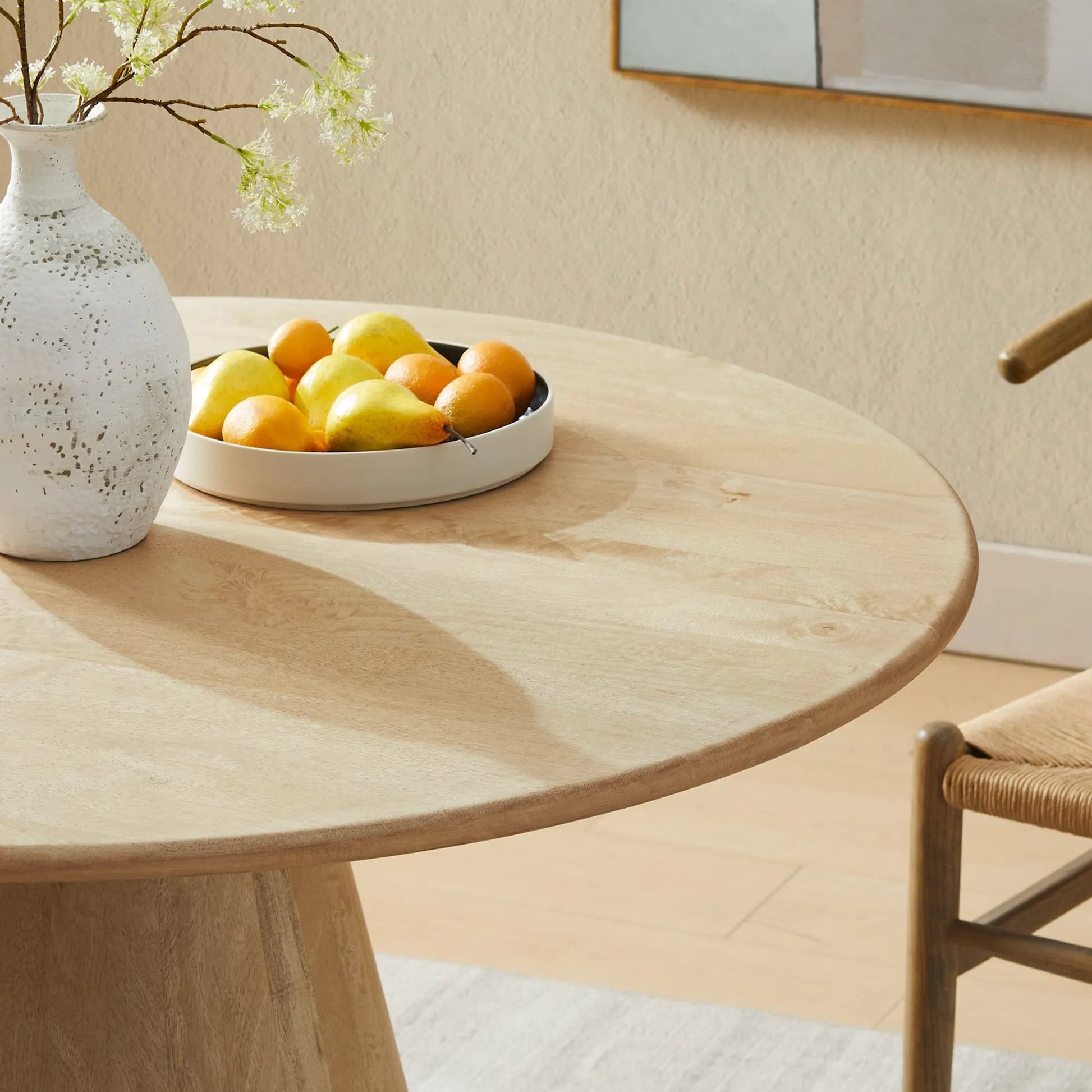 Barranquitas 47" Round Wood Dining Table by Evans & Londeen in natural. Made from wood in a transitional style.