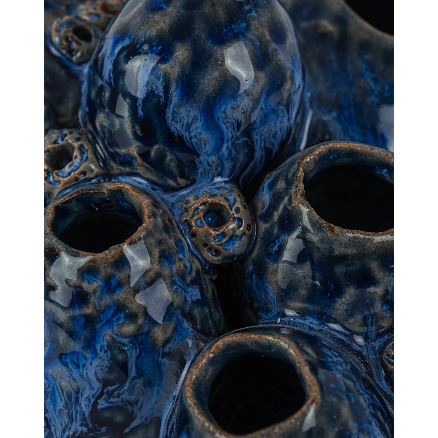 005 SI-2387159 | Closeup | Sulawasi Blue Shells by Currey and Company in reactive dark blue. Made from ceramic in a eclectic & global style.