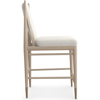 Unity Light Counter Stool by Caracole. Made from oak in a unique style.