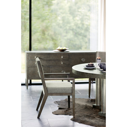Linea Round Dining Table by Bernhardt in cerused charcoal, textured graphite metal. Made from white oak veneers, cast aluminum in a unique style.