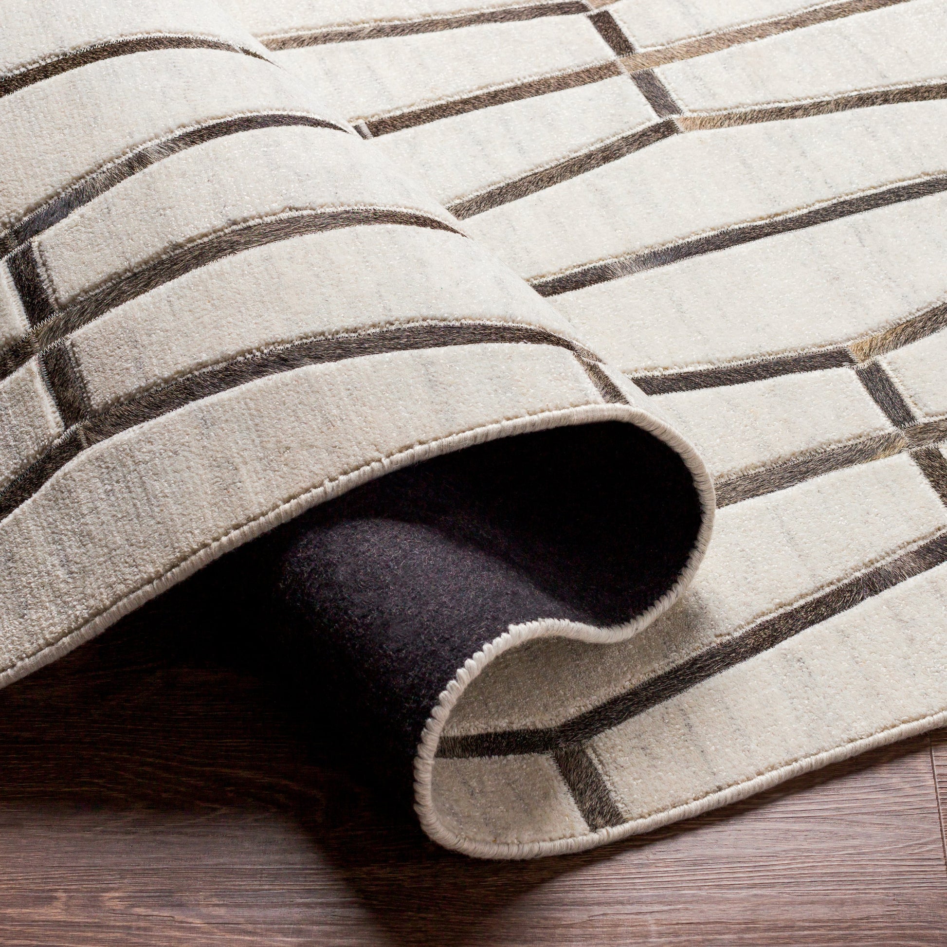 Eloquent ELQ-2302 Rug by Surya in light gray, medium gray, black, gray, charcoal. Made from 80% viscose, 20% leather in a unique style.