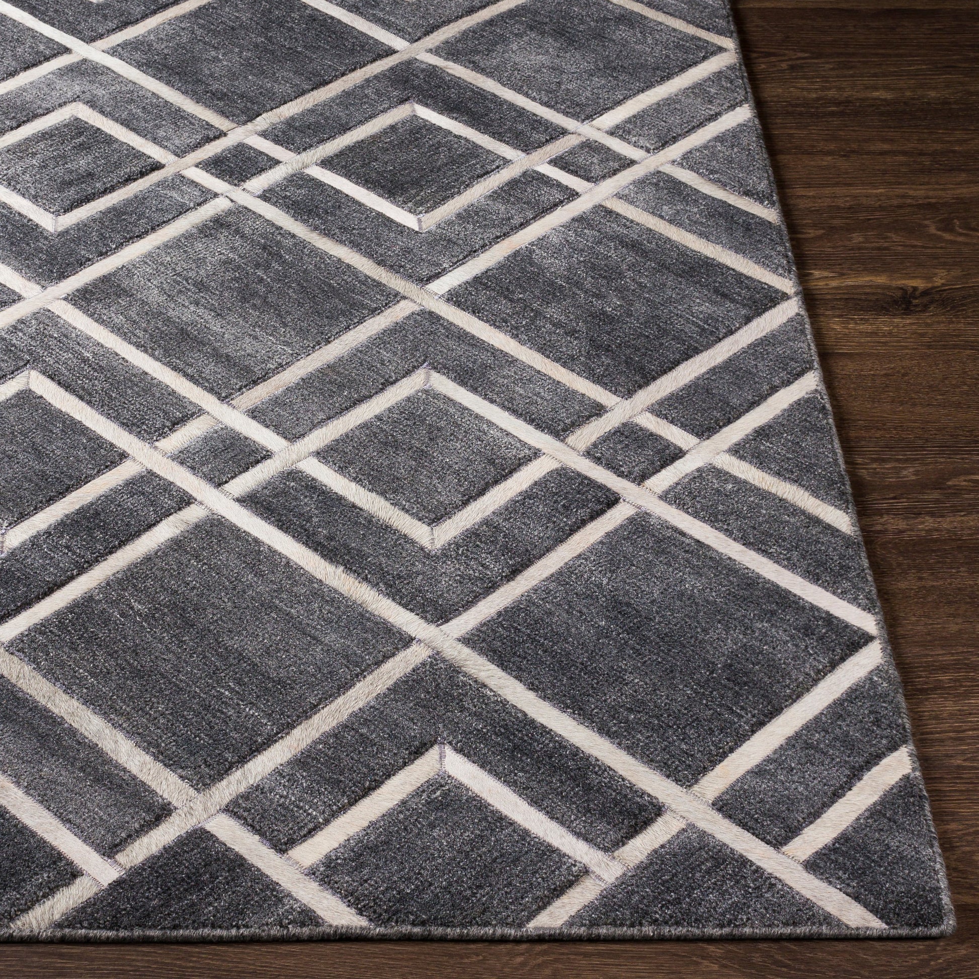 Eloquent ELQ-2305 Rug by Surya in black, gray, light gray. Made from 80% viscose, 20% leather in a unique style.