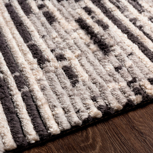 Enzo Rug by Livabliss in black, light gray, cream. Made from 100% polyester in a traditional style.