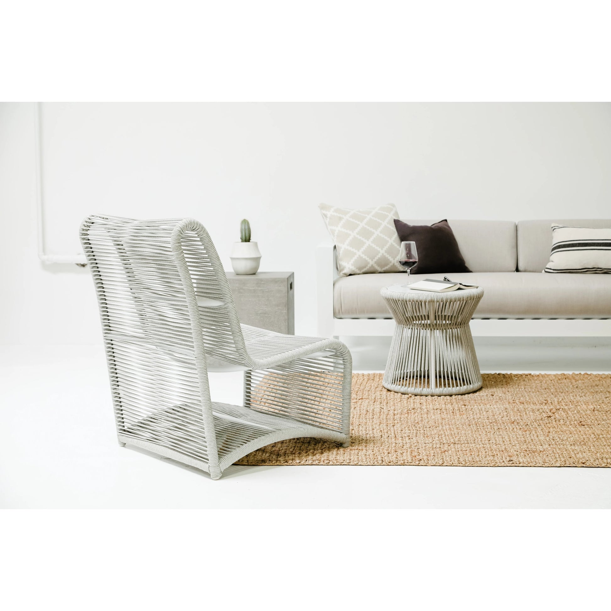 Milano Outdoor Armless Club Chair by Sunset West. Made from olefin rope in a coastal style.