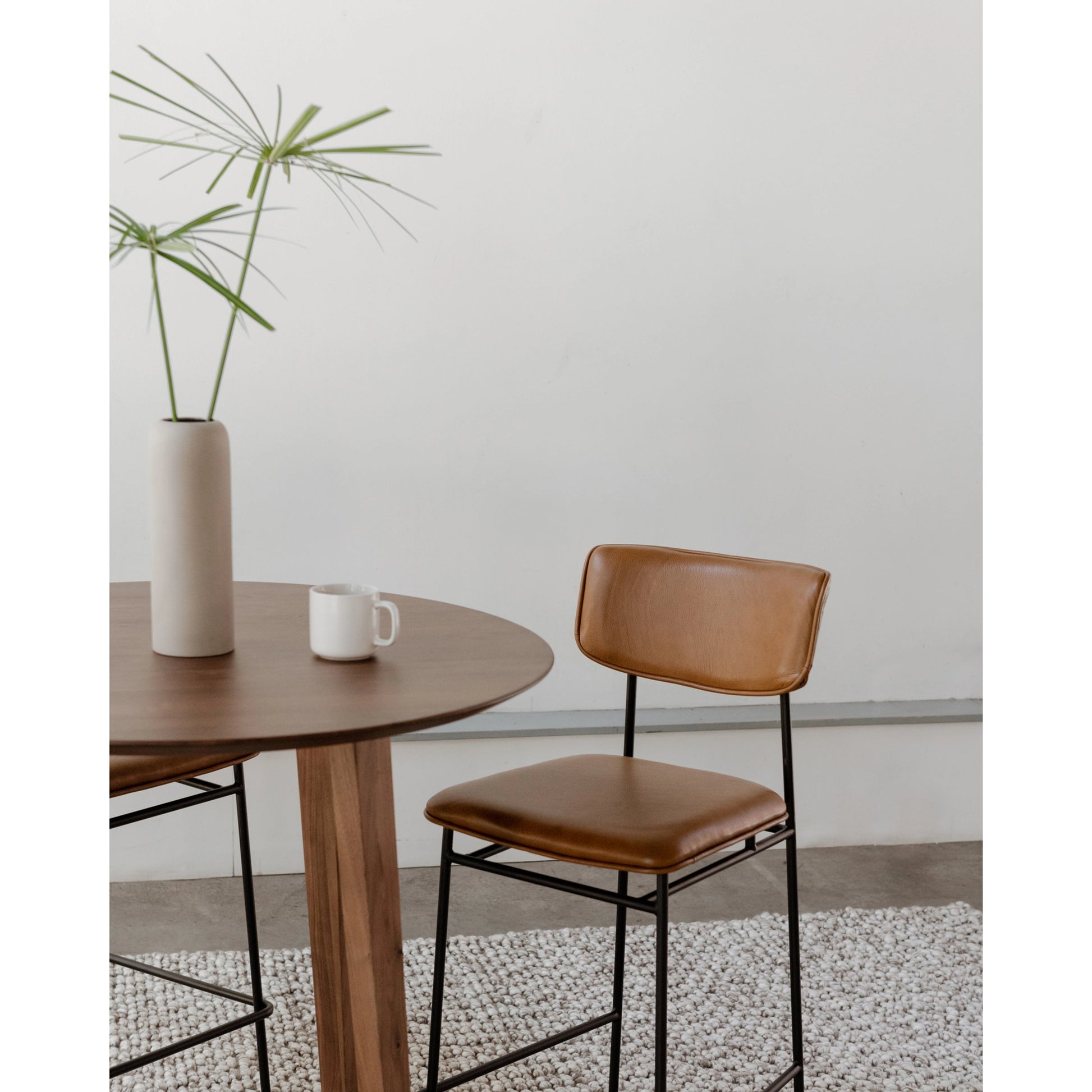Sailor Counter Stool by Moe's Home Collection in brown. Made from upholstery: 100% top grain leather, powder-coated metal frame, plywood, foam padding in a transitional style.
