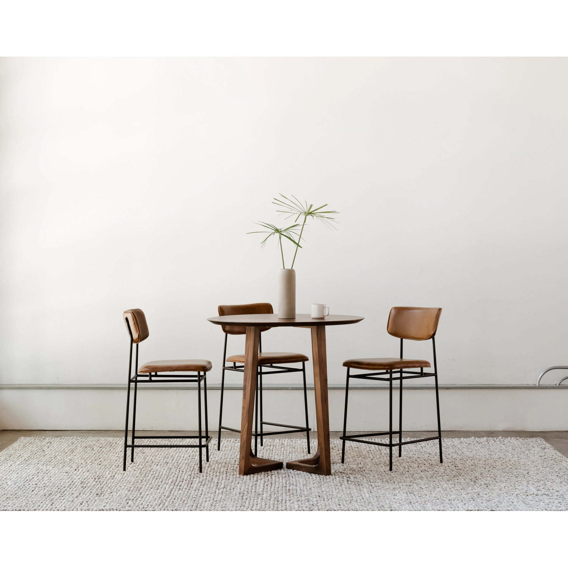 Sailor Counter Stool by Moe's Home Collection in brown. Made from upholstery: 100% top grain leather, powder-coated metal frame, plywood, foam padding in a transitional style.