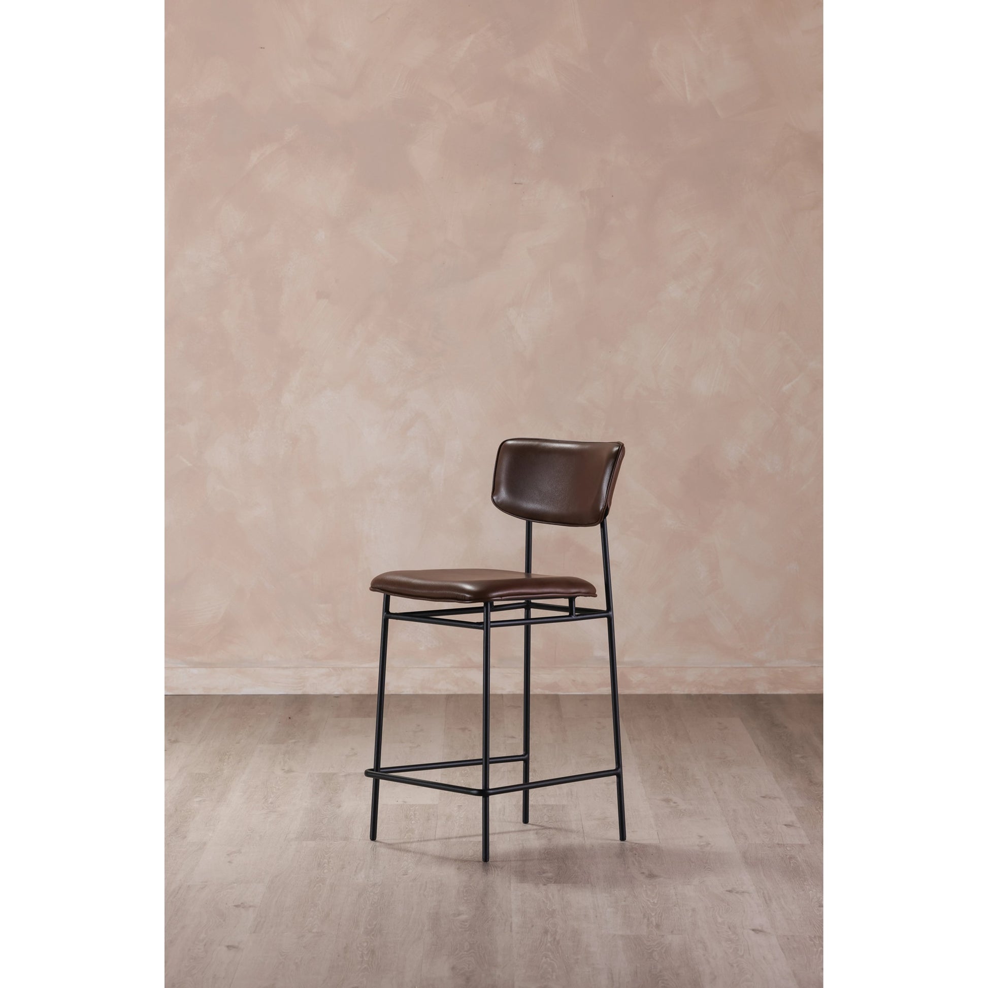 Sailor Counter Stool by Moe's Home Collection in brown. Made from upholstery: 100% top grain leather, powder-coated metal frame, plywood, foam padding in a transitional style.