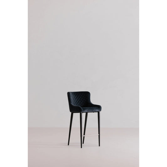 Etta Counter Stool by Moe's Home Collection in dark gray and powder coated. Made from 100% polyester velvet upholstery, metal frame in a modern style.