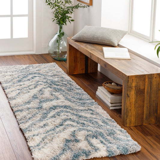 Eskimo Shag by Livabliss in blue, light gray, light beige, cream. Made from 100% polypropylene in a modern style.