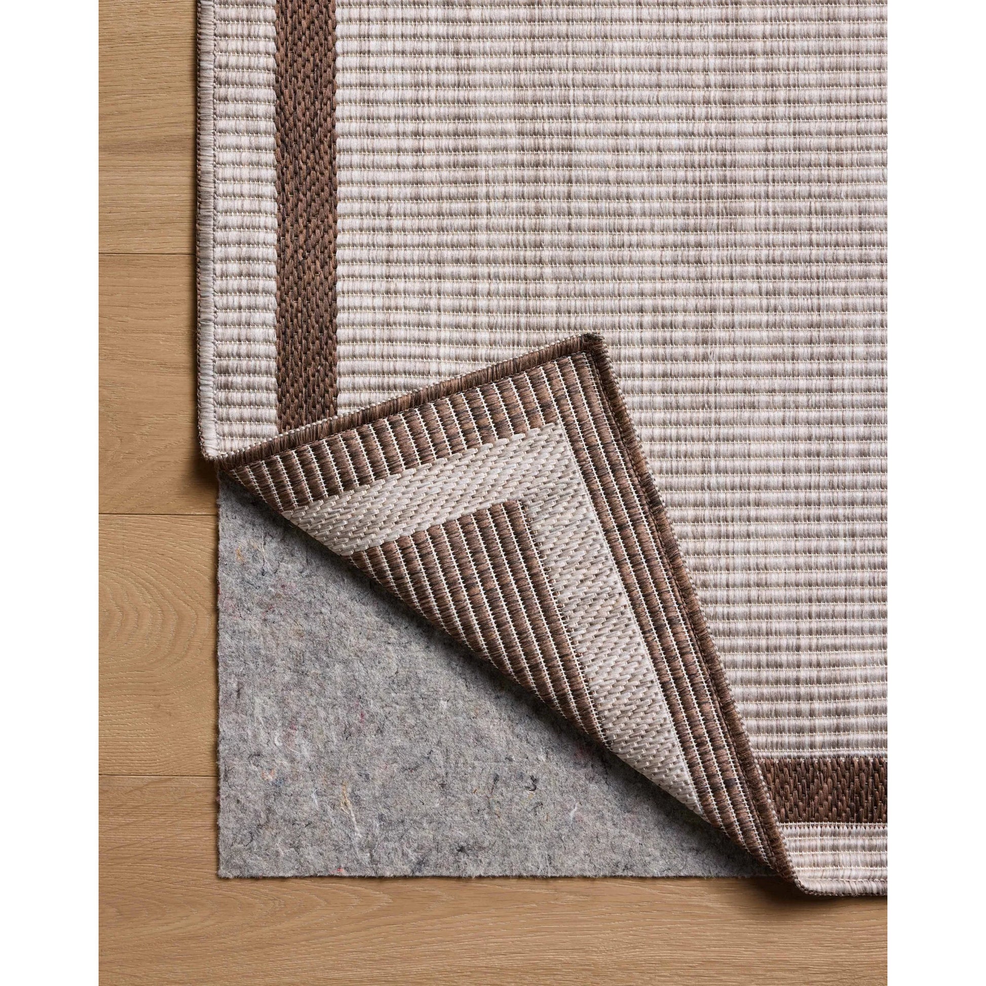 Easton ESN-02 Outdoor Rug by Loloi in dove, coffee. Made from 100% polypropylene in a unique style.
