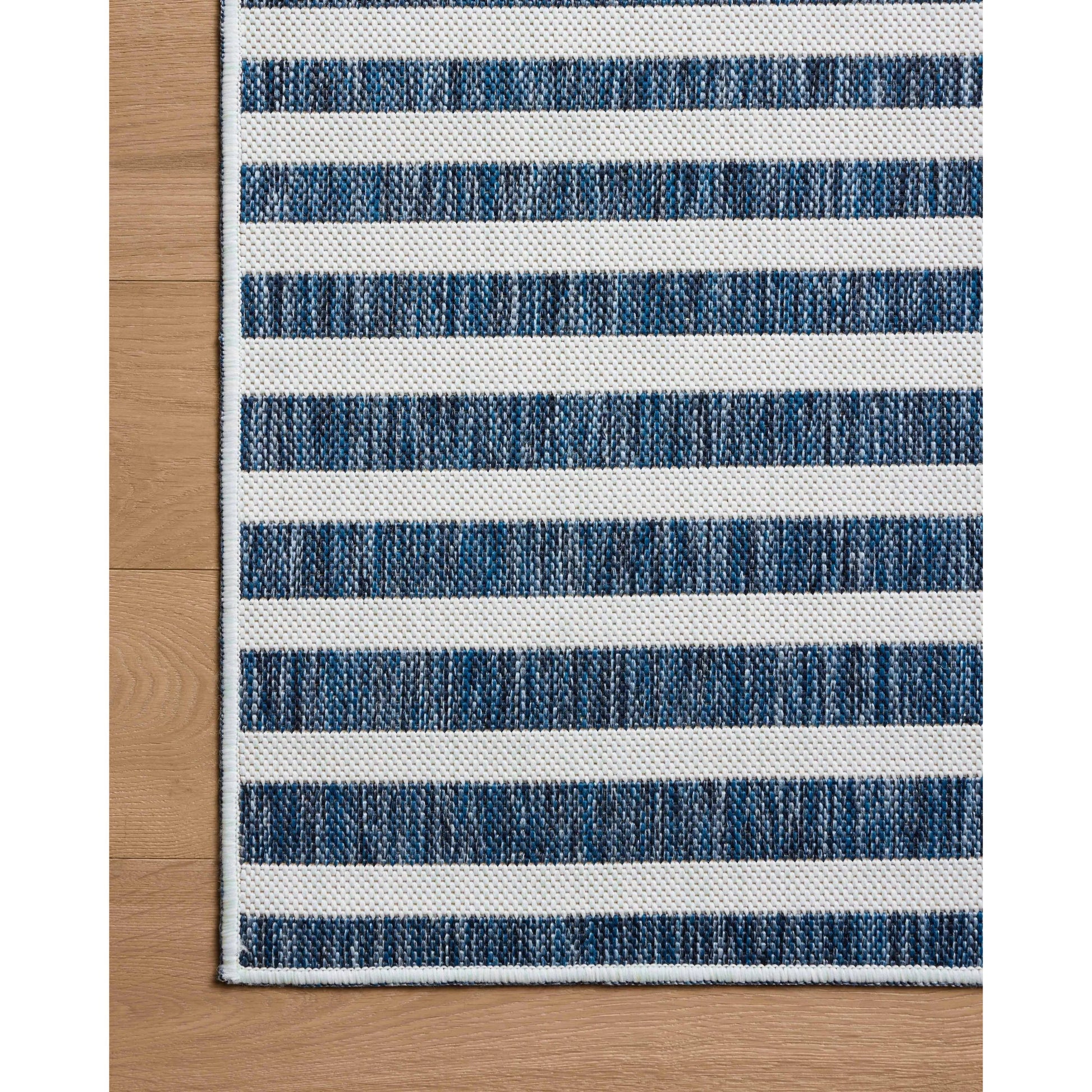 Easton ESN-03 Outdoor Rug by Loloi in denim, ivory. Made from 100% polypropylene in a unique style.