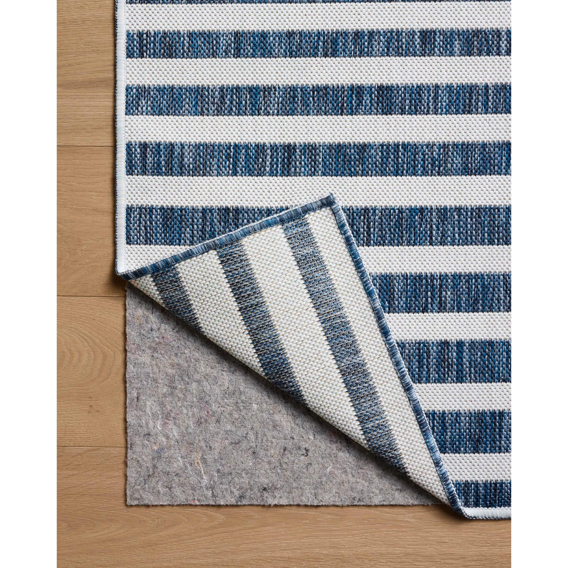 Easton ESN-03 Outdoor Rug by Loloi in denim, ivory. Made from 100% polypropylene in a unique style.