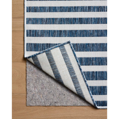 Easton ESN-03 Outdoor Rug by Loloi in denim, ivory. Made from 100% polypropylene in a unique style.