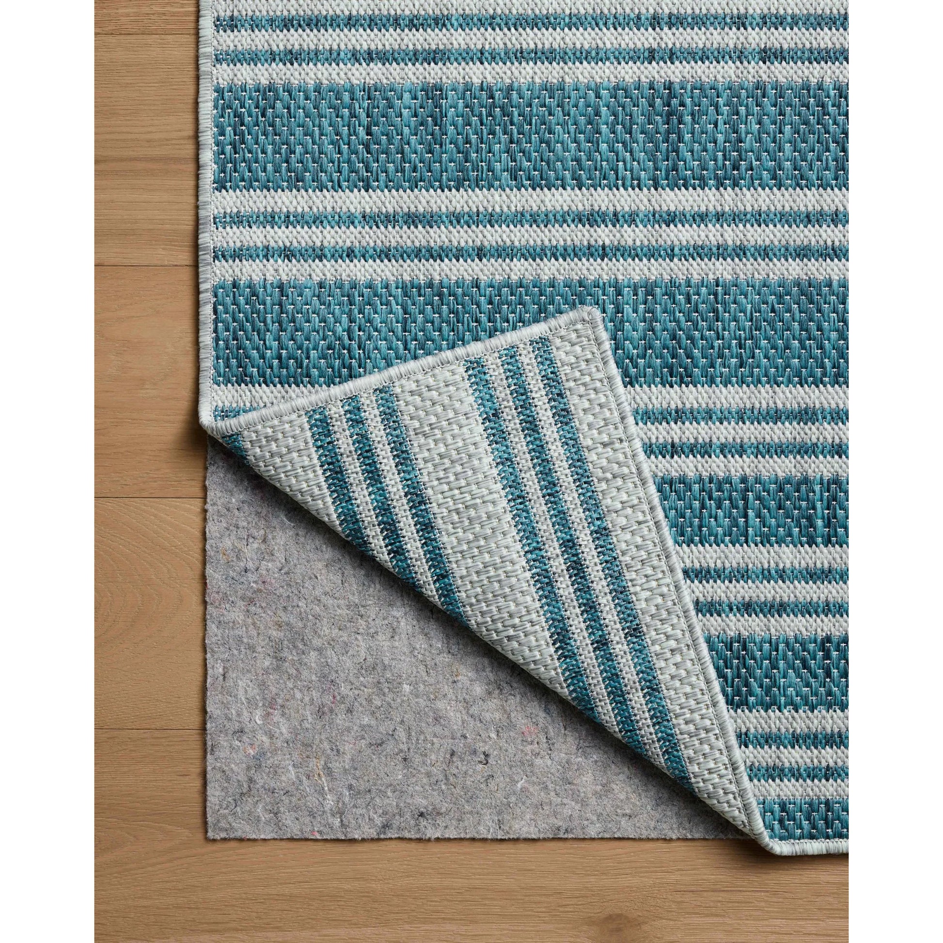Easton ESN-04 Outdoor Rug by Loloi in teal, fog. Made from 100% polypropylene in a unique style.