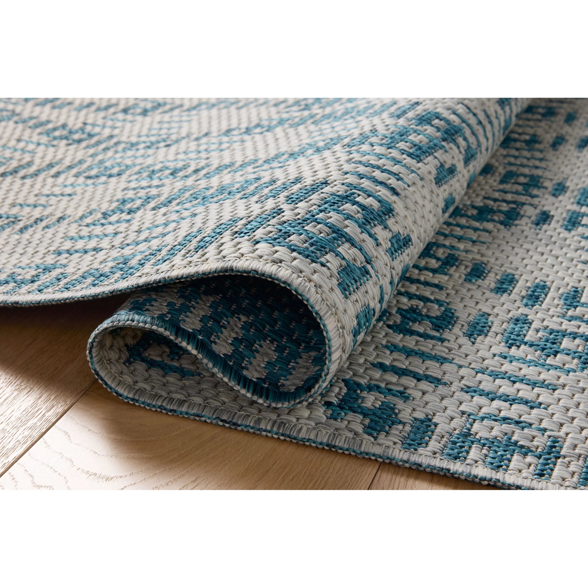Easton ESN-10 Outdoor Rug by Loloi in fog, teal. Made from 100% polypropylene in a unique style.