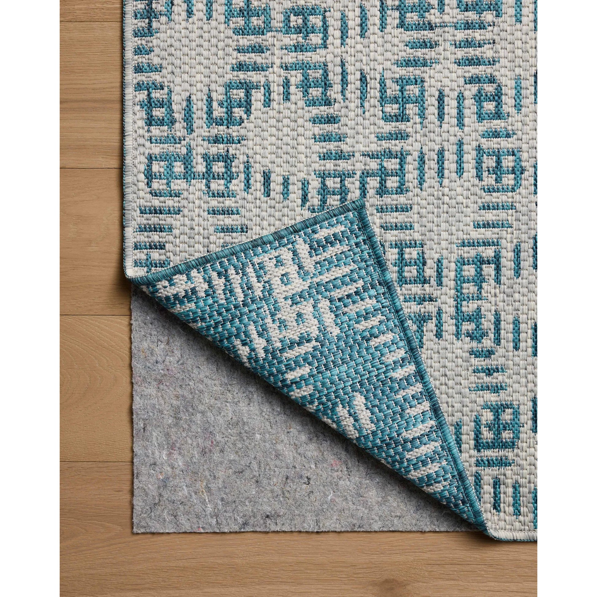 Easton ESN-10 Outdoor Rug by Loloi in fog, teal. Made from 100% polypropylene in a unique style.