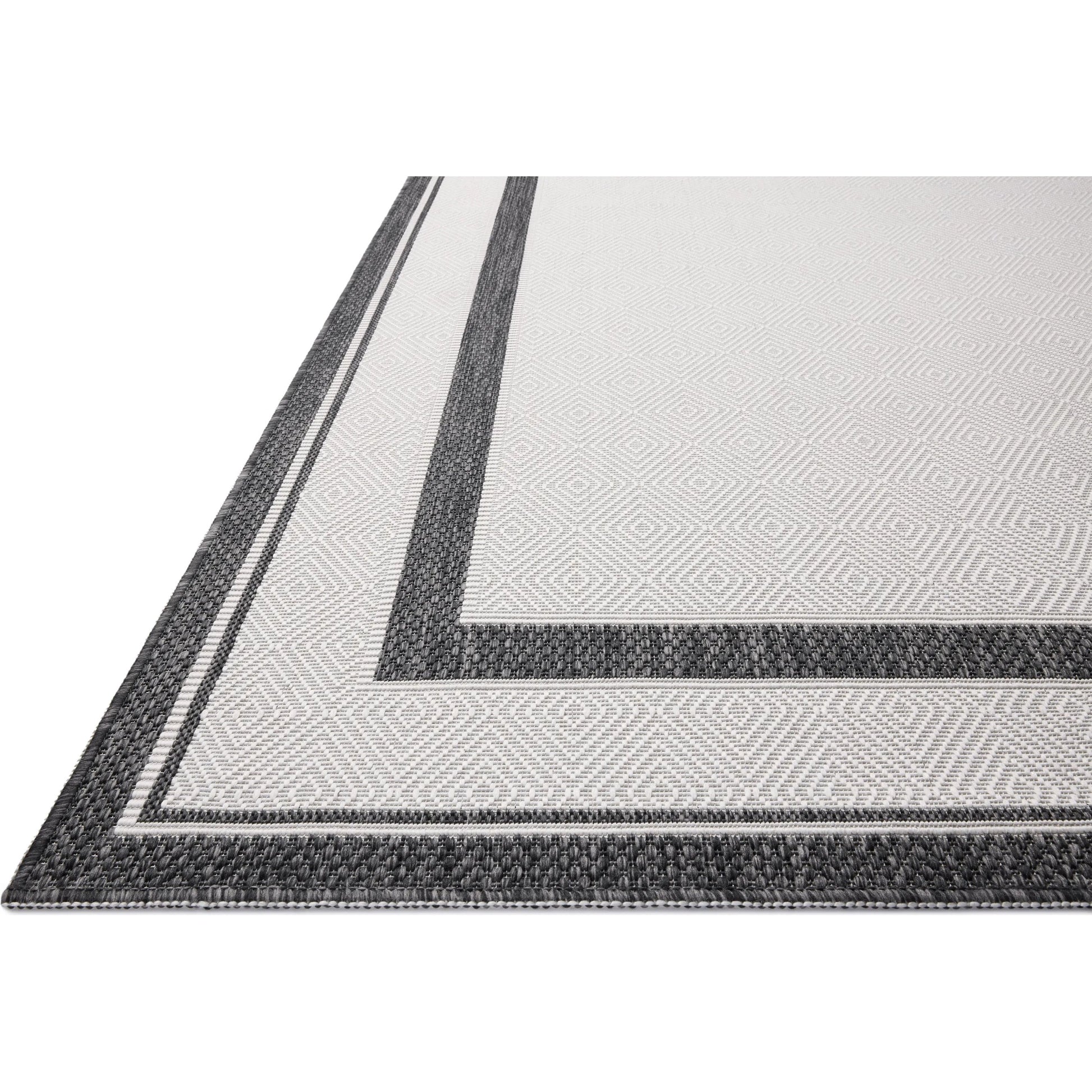 Easton ESN-11 Outdoor Rug by Loloi in onyx, ivory. Made from 100% polypropylene in a unique style.