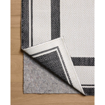Easton ESN-11 Outdoor Rug by Loloi in onyx, ivory. Made from 100% polypropylene in a unique style.