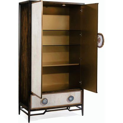 Mercia Bar Cabinet by John-Richard in black, gold, walnut and windsor black, tiza gesso, aztec gold. Made from solid beech, american black walnut, celtis veneers, mdf, agate, pristine wood laminate in a transitional style.