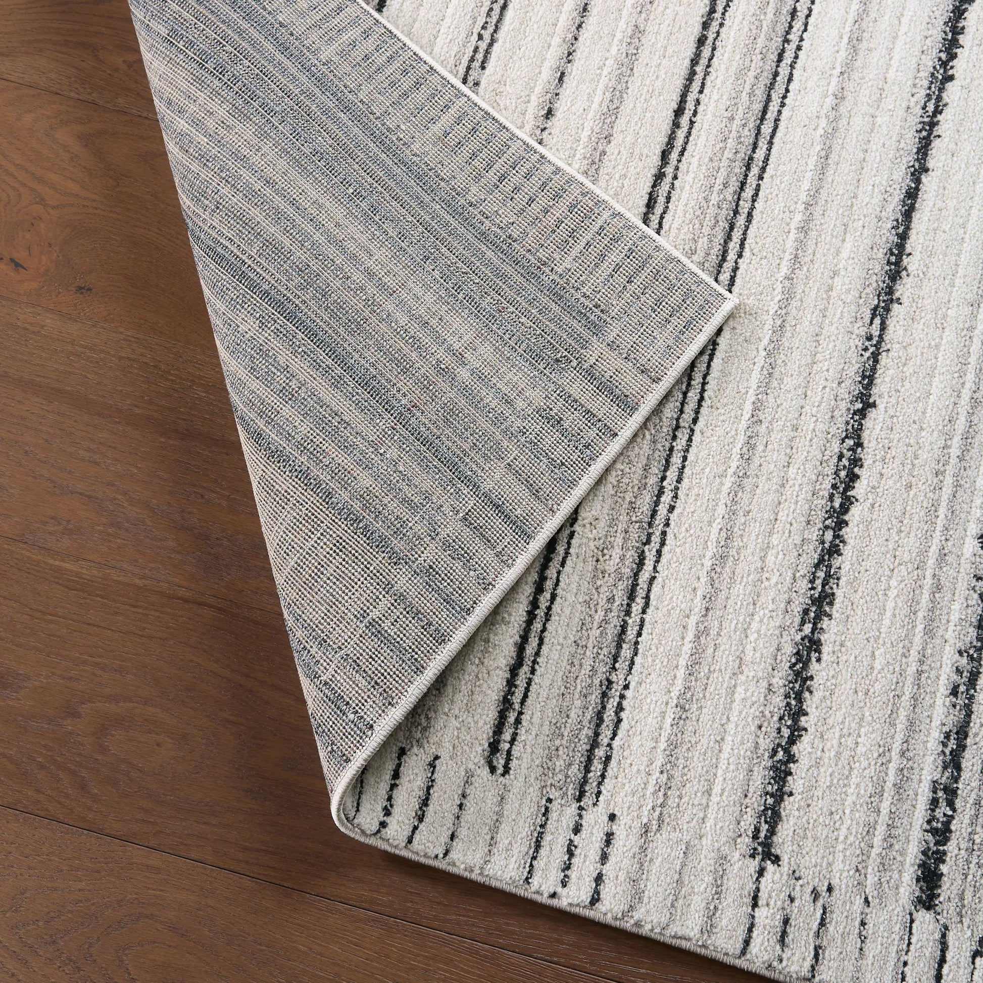 Eva EVA04 Rug by Jaipur Living in ivory, gray, black. Made from 100% polyester in a unique style.