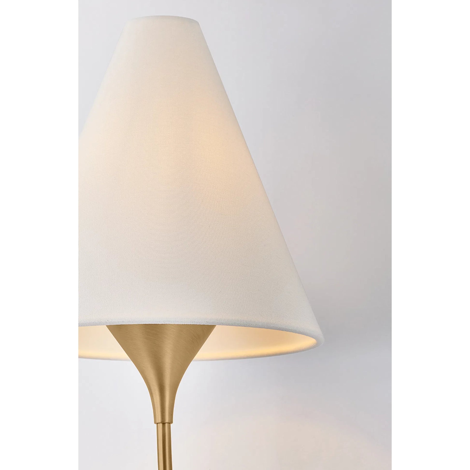 Evermore Wall Sconce by Troy in patina brass. Made from unique in a transitional style.