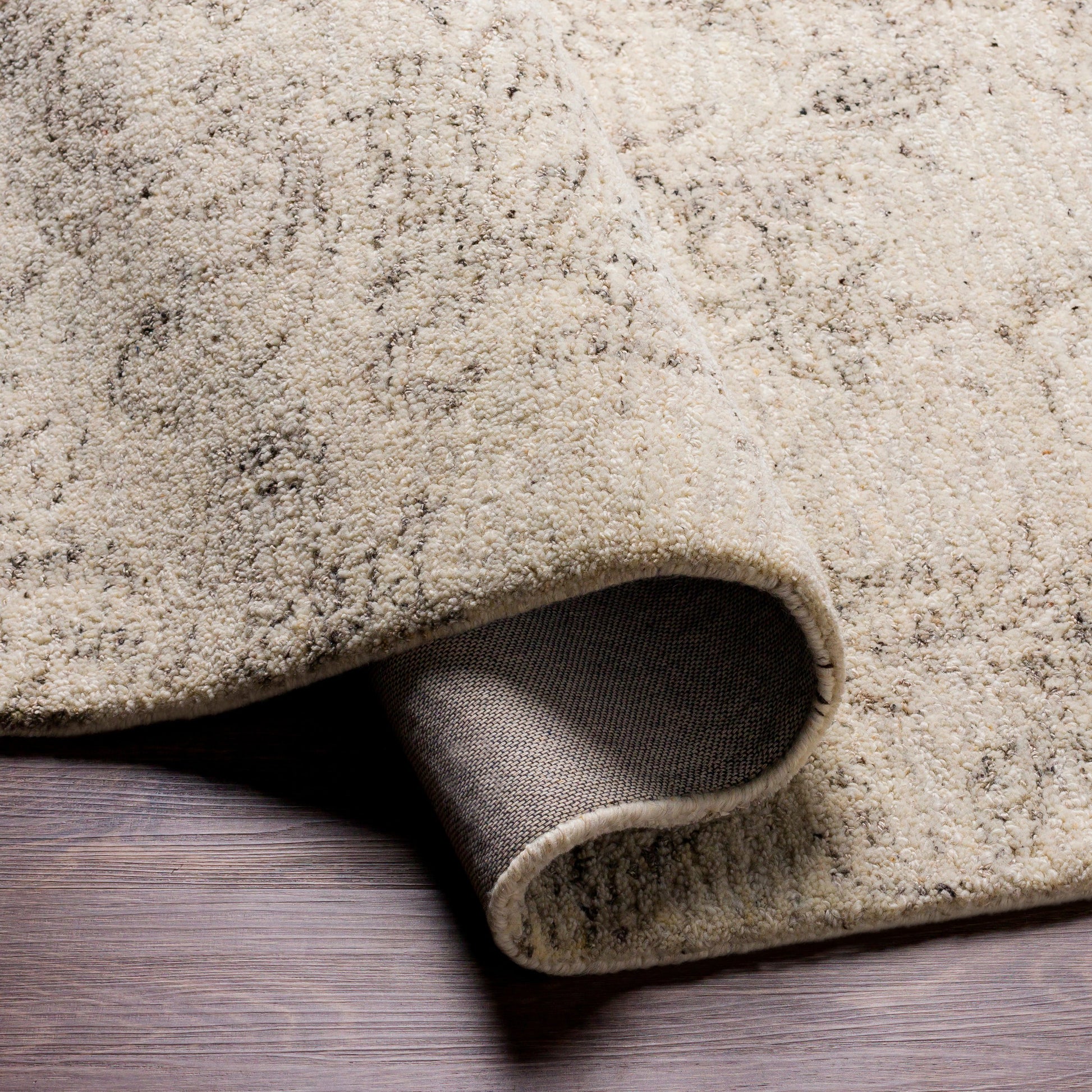Evolution Rug by Surya in gray, charcoal, light beige, cream. Made from 70% wool, 30% viscose in a traditional style.