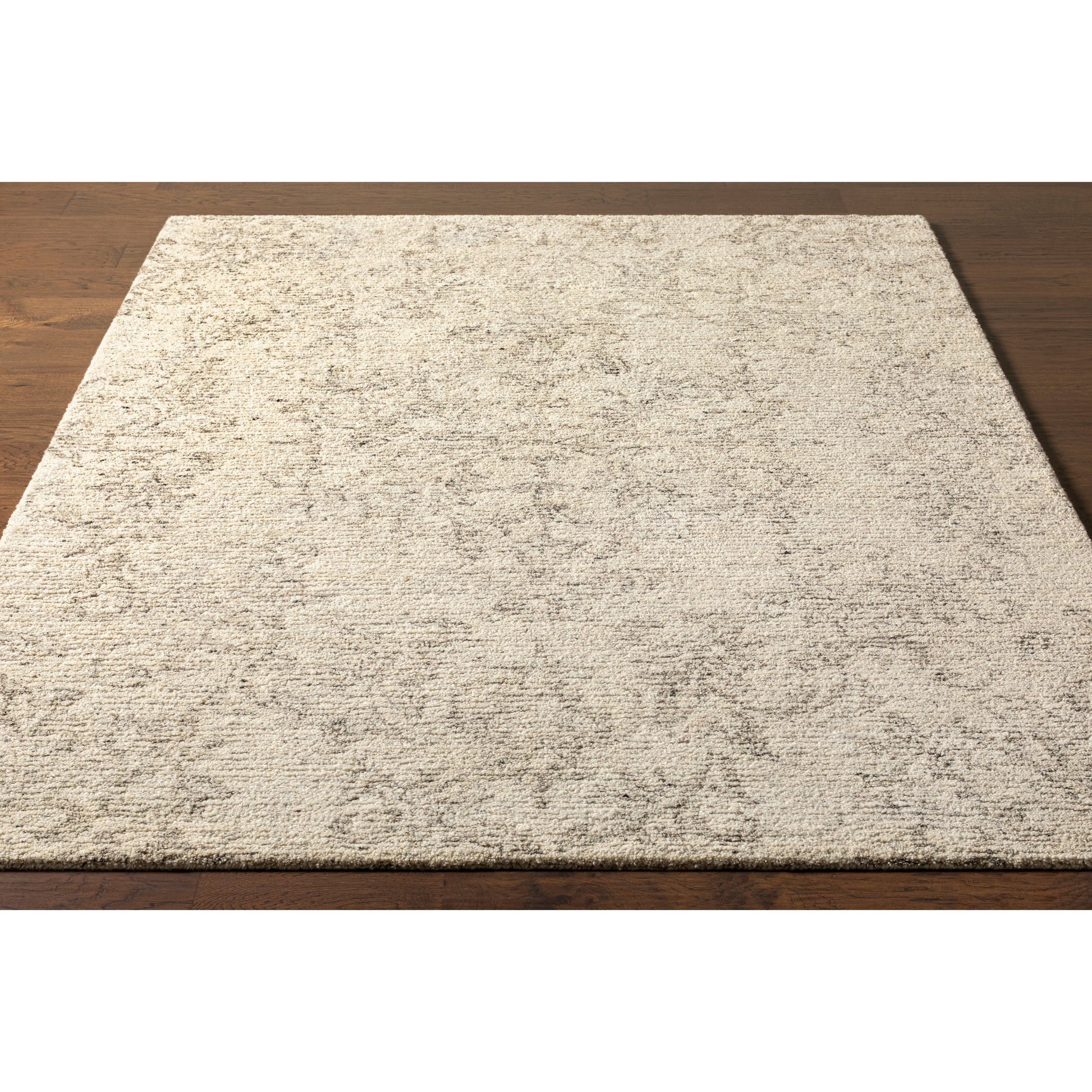 Evolution Rug by Surya in gray, charcoal, light beige, cream. Made from 70% wool, 30% viscose in a traditional style.