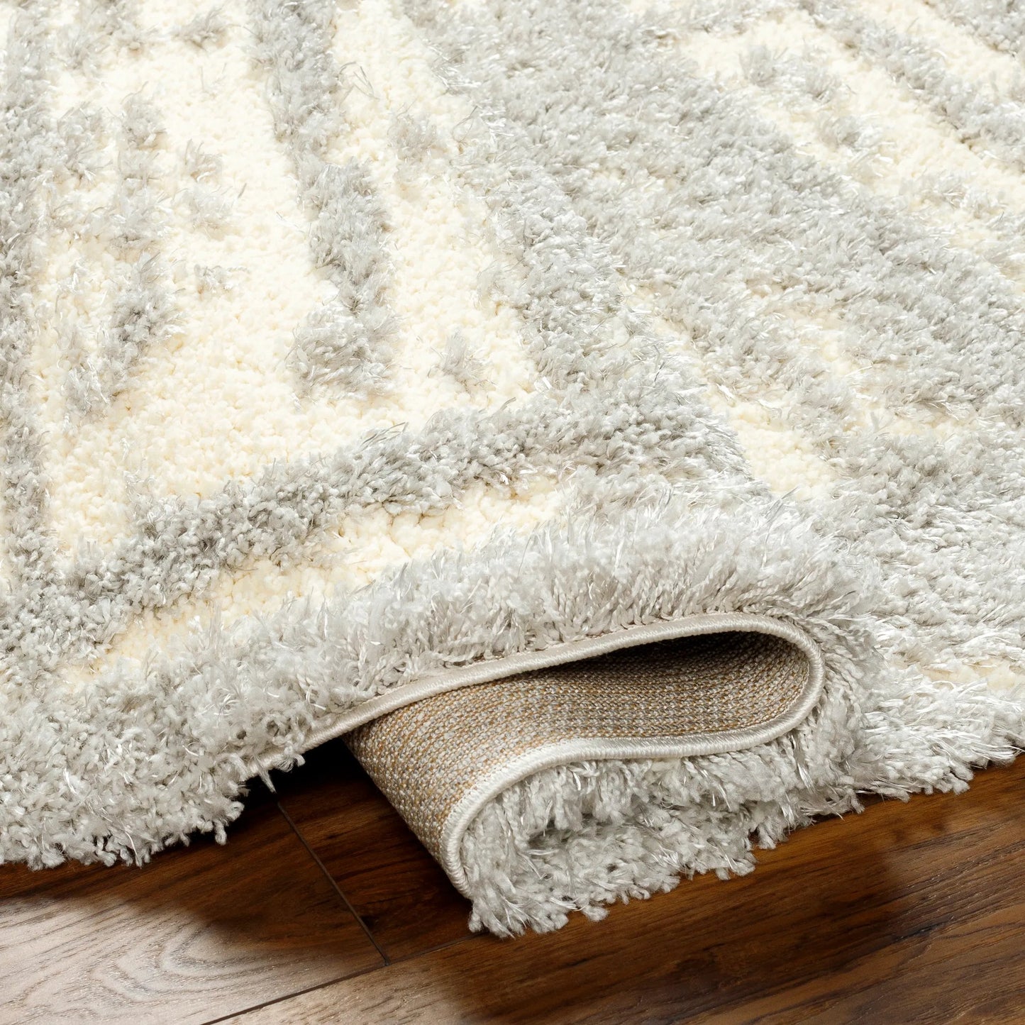 005 SI-1948812,SI-1948814 | Closeup | Everton Plus Area Rug by Livabliss in light gray, gray. Made from main: 51% polyester, main: 49% polypropylene in a unique style.