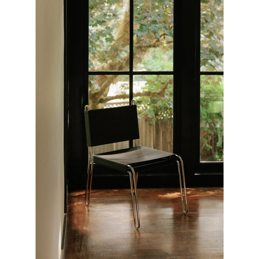 Petra Leather Accent Chair by Moe's Home Collection in black. Made from top grain leather, polished stainless steel frame, black cotton canvas seat support in a unique style.