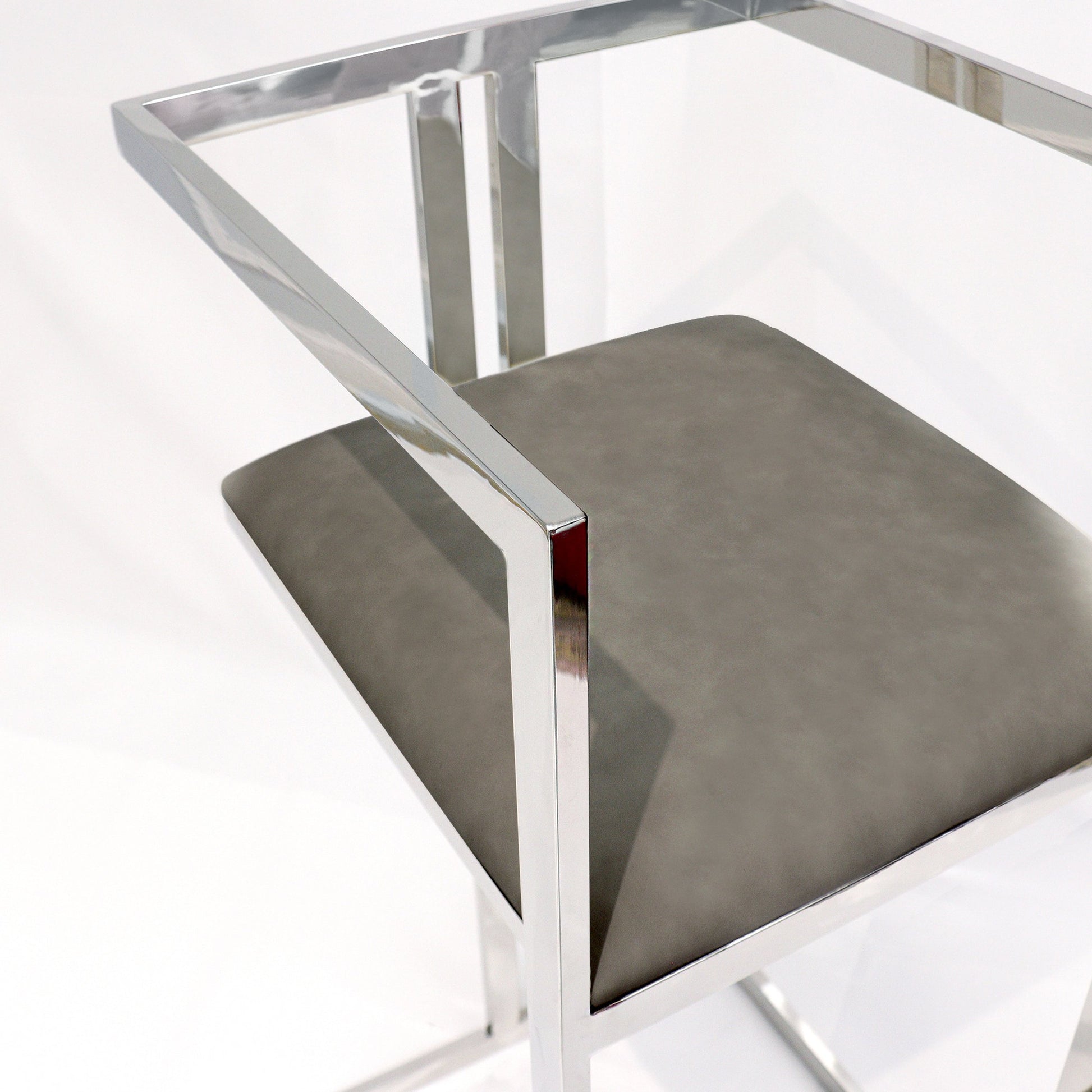 Luxe Bar Stool by Pasargad Home in chrome. Made from faux leather in a modern style.